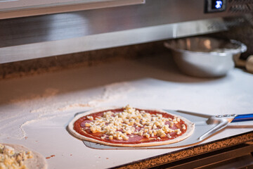 The chef prepares pizza. Raw pizza ready to oven