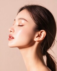 Fototapeta premium Glowing skin portrait of asian young woman minimalist studio beauty soft lighting profile view skincare concept