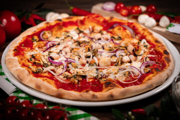 Pizza frutti di mare seafood, mozzarella mussels octopus squid, salmon, shrimp