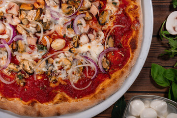 Pizza frutti di mare seafood, mozzarella mussels octopus squid, salmon, shrimp