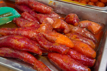 Traditional Mexican street food, candied sweet potatoes, close-up.