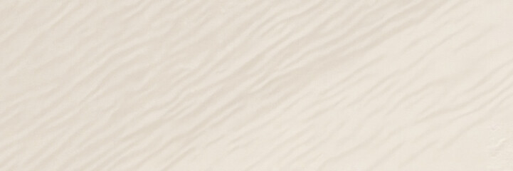 Fototapeta premium Smooth beige textured background with subtle wavy patterns 