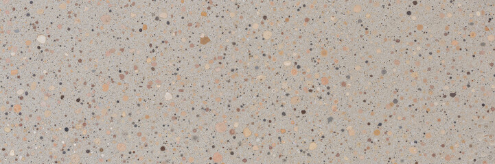 Speckled terrazzo texture with multicolored stone fragments
