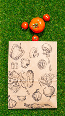 a paper bag lies on the green grass with fruits and vegetables around, moss, mock up