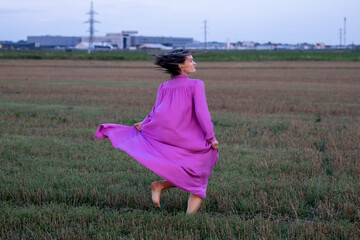 Young Woman's Dance of Freedom in Windy Fields: The Harmony of Femininity and Freedom