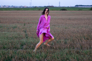 Young Woman's Dance of Freedom in Windy Fields: The Harmony of Femininity and Freedom