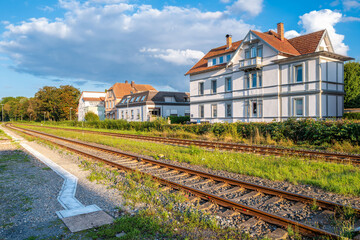 A scenic view of a railway track running alongside residential houses in Bad Mergentheim 