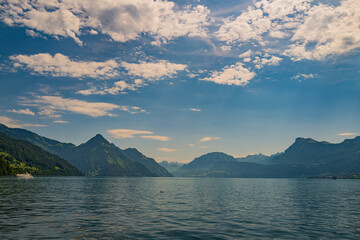 Mountain in the in summer, panoramic view with mountain. Alps mountains. Alpine mountain scenery. Mountain with lake in Alps. Mountains over the lake and the alps.