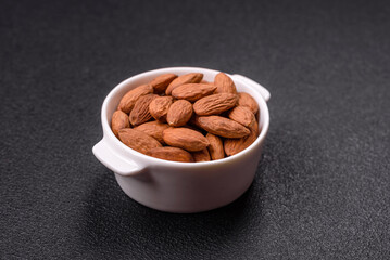 Delicious nutritious almond nuts in ceramic bowl