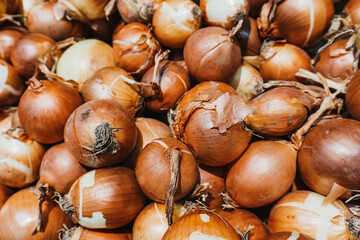 Fresh onions. Onions background. Ripe onions. Onions in market