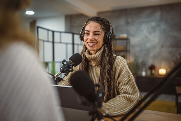 young woman presenter interview female guest and stream audio podcast