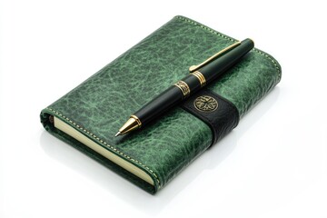 Green Writing Pad Accompanied by a Pen on a Crisp White Surface