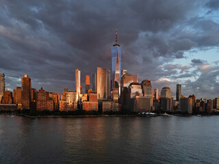 NYC aerial view, New York City Skyline with dramatic sky. Panoramic drone view on Manhattan in NY. Sunset in NYC.