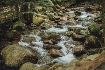 Autumn waterfall in the mountains, water flowing down rocks, New England