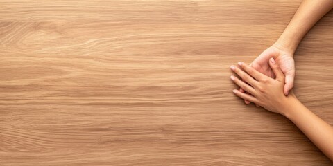 Unity in togetherness hands joined on smooth wooden surface human connection calm environment close-up perspective