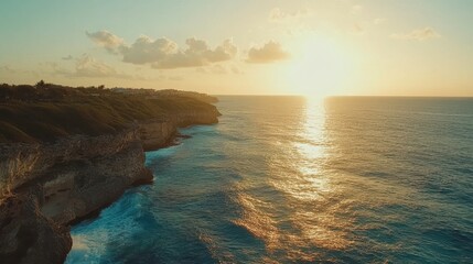 Obraz premium Vibrant Sunset Over Ocean and Cliffs