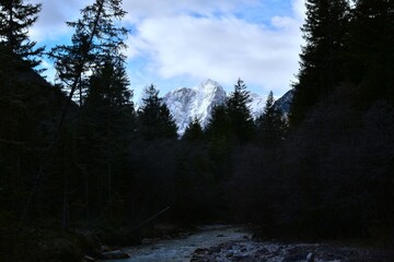 View of snow covered Stenar mountain peak at Vrata and Triglavska Bistrica river in Julian alps,...