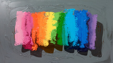 Naklejka premium Vibrant abstract painting featuring a spectrum of rainbow colors blending harmoniously on a textured surface