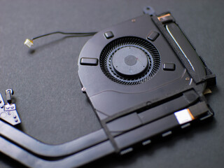Close up of fan cooling system inside notebook. Detail for laptop cooling.
