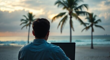 Fototapeta premium A person working remotely on a laptop by the beach with palm trees and a beautiful ocean view