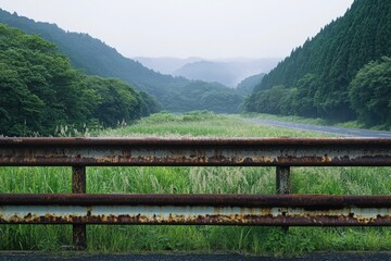 Fototapeta premium railing along a rural road in nature