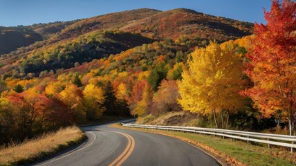 Fototapeta premium asphalt road trip,Asphalt path winding through vibrant autumn foliage and hills