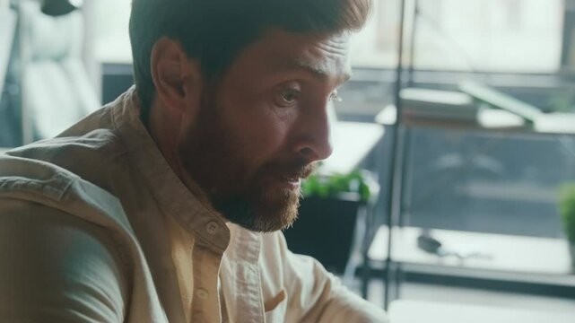 Overwhelmed office worker is dealing with the stressful challenges staring at computer screen