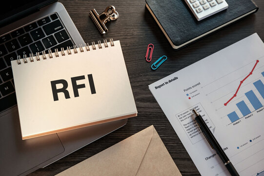 There is notebook with the word RFI. It is an abbreviation for Request For Information as eye-catching image.