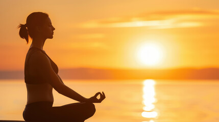 A serene silhouette of a woman practicing yoga at sunset, embodying tranquility and strength amid natures beauty.