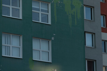 Fototapeta premium A vibrant multicolored building facade featuring an array of textures and intricate paint details that catch the eye