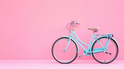 Light blue bicycle against pink wall. (1)
