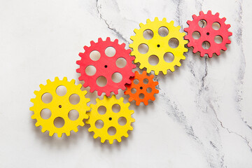 Wooden gears on light background