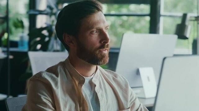 Dedicated and Focused Professional Excelling With Self-Satisfied Smile in a Modern Office Environment 