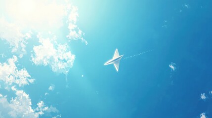 Fototapeta premium Paper airplane soaring through clear blue sky