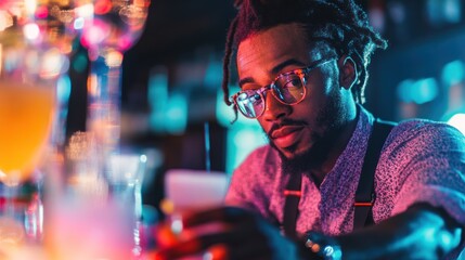 Bartender checking order at a brightly lit bar.