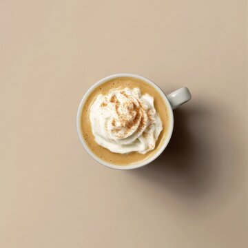 Creamy pumpkin spice latte in a mug. Featuring pumpkin puree and spices
