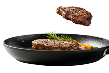 A steak is being cooked on a grill and is about to be flipped