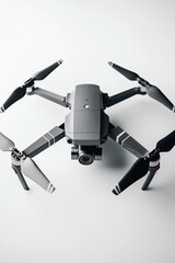 Gray drone with four propellers, a camera, and sleek design.  Perfect for aerial photography and videography.