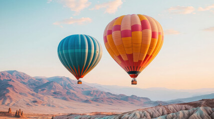 Obraz premium Breathtaking hot air balloons soaring over stunning mountain landscapes at sunrise