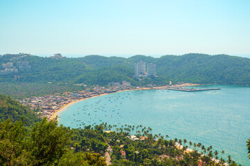 Panoramic view of Puerto Marques Bay in Acapulco, Mexico. Several small boats are anchored on the...
