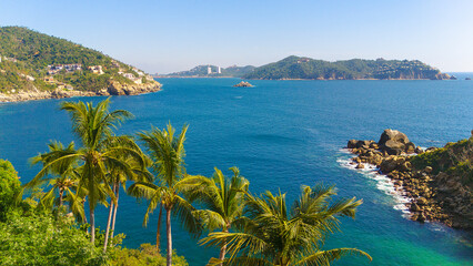 Small paradisiacal bay of rocky coast in Acapulco. 4 palm trees frame the place. The tranquility and exclusivity create an environment that allows you to enjoy the nature of the Mexican Pacific Ocean.