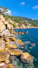 Small paradisiacal bay of rocky coast in Acapulco, Mexico. The tranquility and exclusivity create...