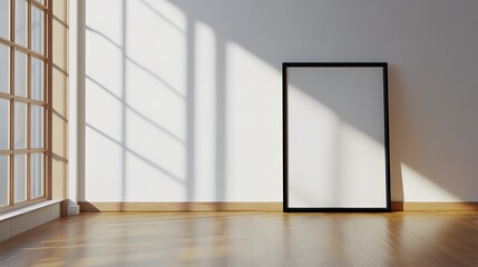 Obraz premium Square black frame leaning on a white wall in a hardwood-floored interior