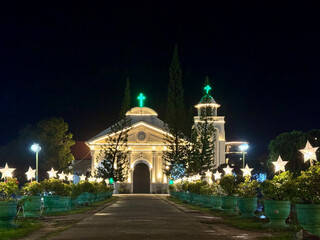 Illuminated Church and Star Decorations at Night