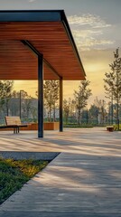 Naklejka premium Modern Outdoor Pavilion at Sunset in Urban Park Landscape