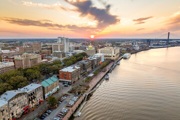 Aerial view of Savannah, old historical city in Georgia. River Street buildings architecture at night