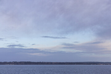 Serene Coastal Landscape with Calm Waters Under a Peaceful Sky