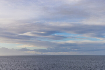 Peaceful Ocean View with Calm Waters and Partially Cloudy Sky