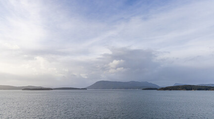 Peaceful Ocean and Island Landscape Under a Serene Blue Sky