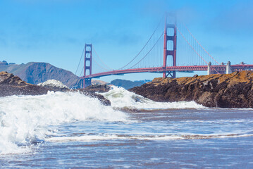 Crashing waves Baker Beach view of Golden Gate Bridge San Francisco California